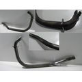 Auspuff-Krmmerrohr (fr Zylinder 1)<br>Zustand: Gebraucht mit Mangel<br><br>Verwendbar fr: Triumph Thunderbird, Typ: T309RT, Modelljahr: von 01/1995 bis 12/2003